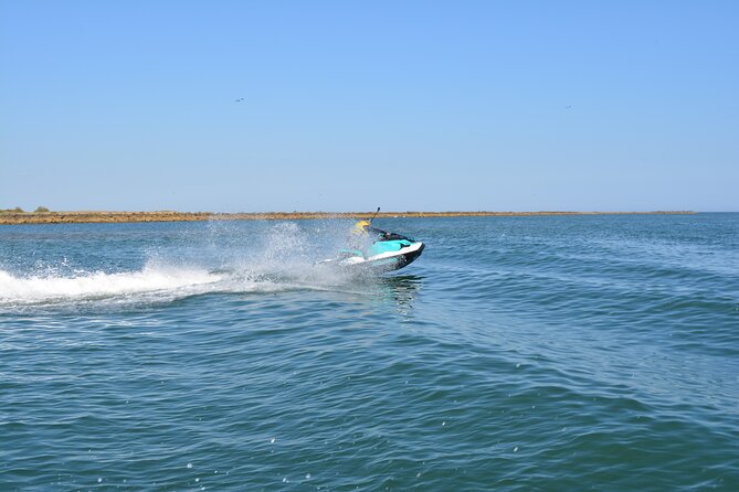 1 Hour Jet Ski Experience in Isla Canela - Open sea, swimming, and the ride back