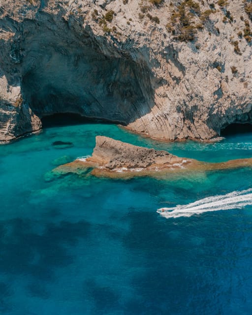 Alcudia: JetSki Tour Coll Baix beach & Caves (free Photos) - Passing Alcanada lighthouse island