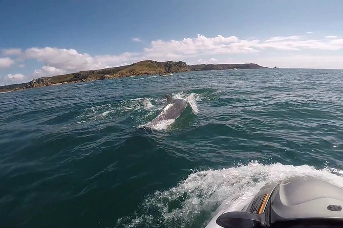 Escorted Coastal Tour by Jet Skis from St. Aubin - La Corbiere Lighthouse gives the ride a clear highlight
