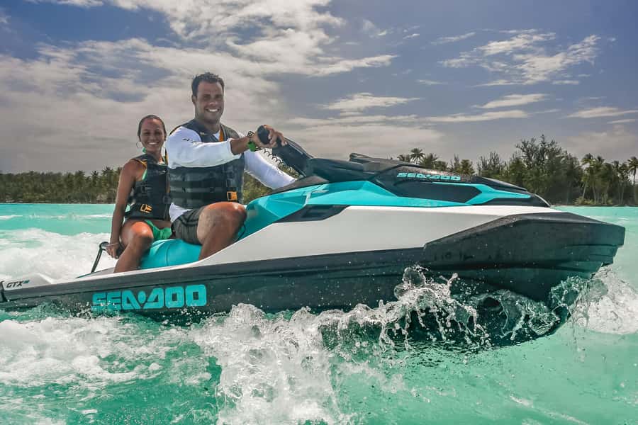 Jet Ski Around Bora Bora - Speed Through Paradise - Swimming in clear lagoon water