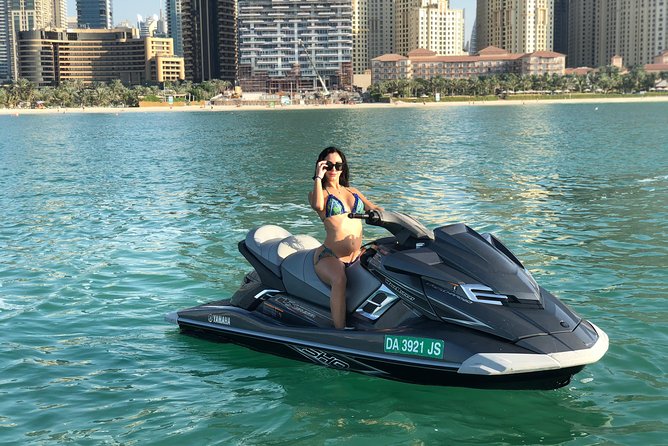 Jet ski Dubai 30 minute Guided Sightseeing Tour - Seeing the giant Ferris wheel from the water