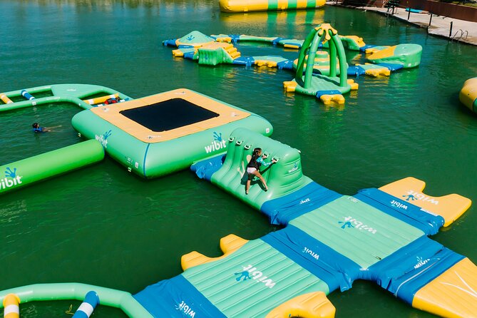 Jet Ski Punta Cana Water Park with Zipline & Inflatable Course - Tackling the giant inflatable obstacle course