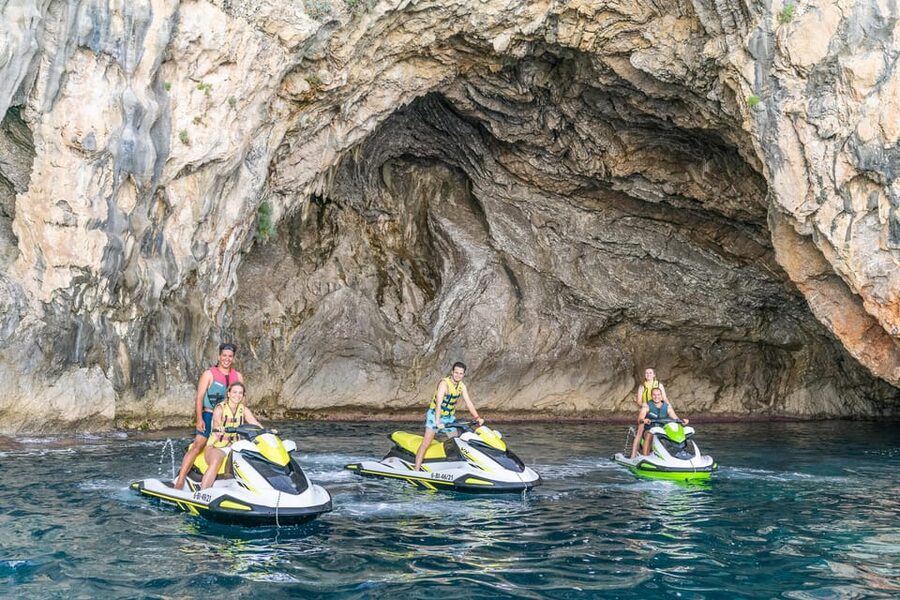 Mallorca Alcudia: Jack Sparrow Cave Jet Ski Tour - Riding across Alcudia Bay