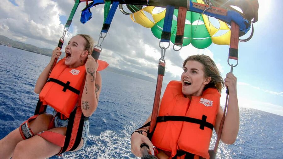 Montego Bay: Parasailing and Jet Ski Combo with Pickup - Parasailing above the Caribbean coastline