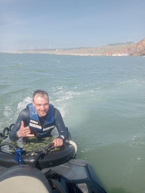 Nazaré: Experience Big Waves Zone on Jet Ski with Sled - Arriving at the glass-fronted warehouse