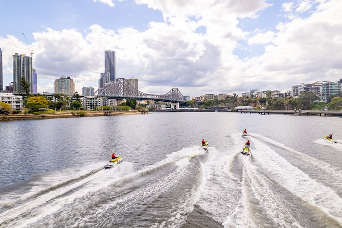 Sunset Jet Ski Tour on the Brisbane River - Brisbane City Markets and the lit skyline